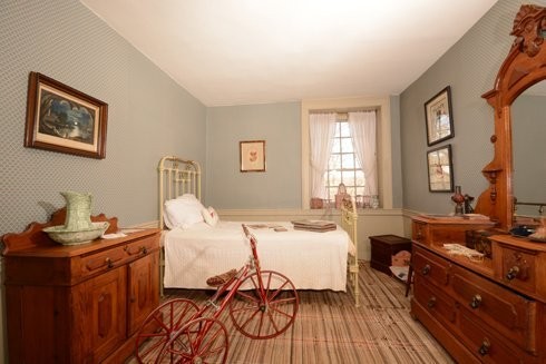 One of the upstairs bedrooms within the Parry Mansion.