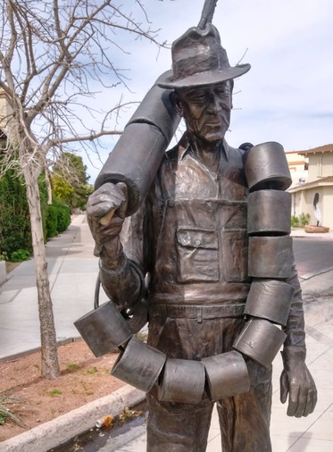 Bronze sculpture near Frank Crowe Memorial Park, "Alabam", honoring workers who held "mundane" but important jobs during construction of Hoover Dam. Alabam helped keep the outhouses stocked with paper. (Source: M. Urashima, April 2018)