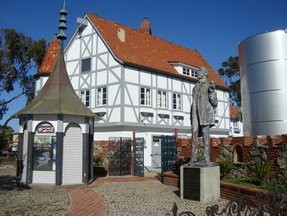 The statue is located next to the new well and a spa. 