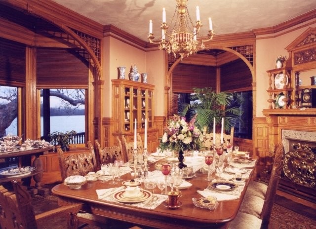 The Museum's dining room with ornately carved woodwork and original dinnerware.  