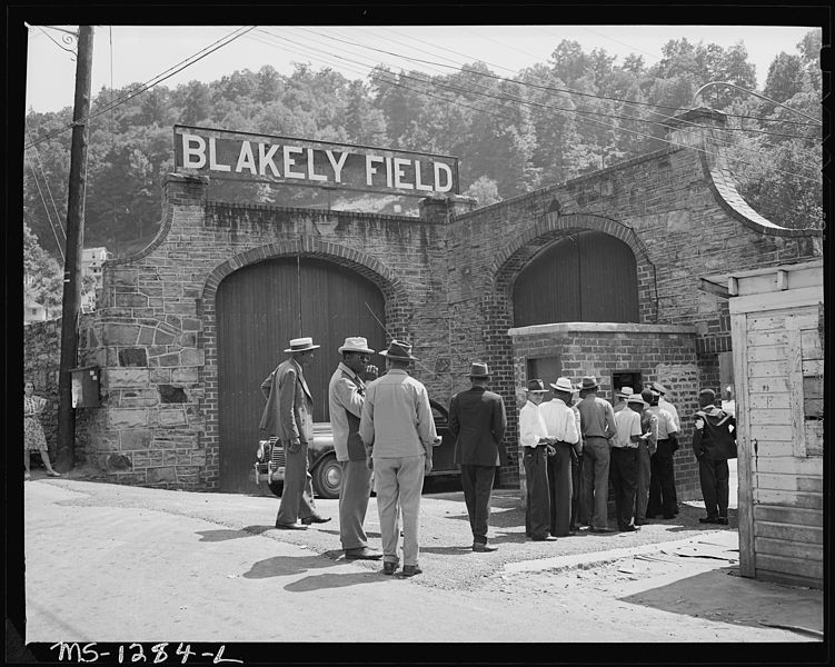 Miners going to a baseball game.