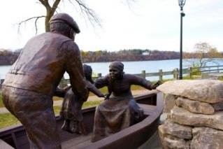 This monument depicts refugees leaving the United States at the Niagara River. 