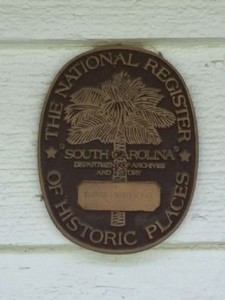 Marker on the building, located between the two front doors, for The National Register of Historic Places