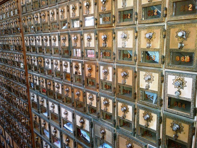 Brass postal boxes inside the Main Street Post Office, Huntington Beach, California. Source: M. Urashima, 2012.