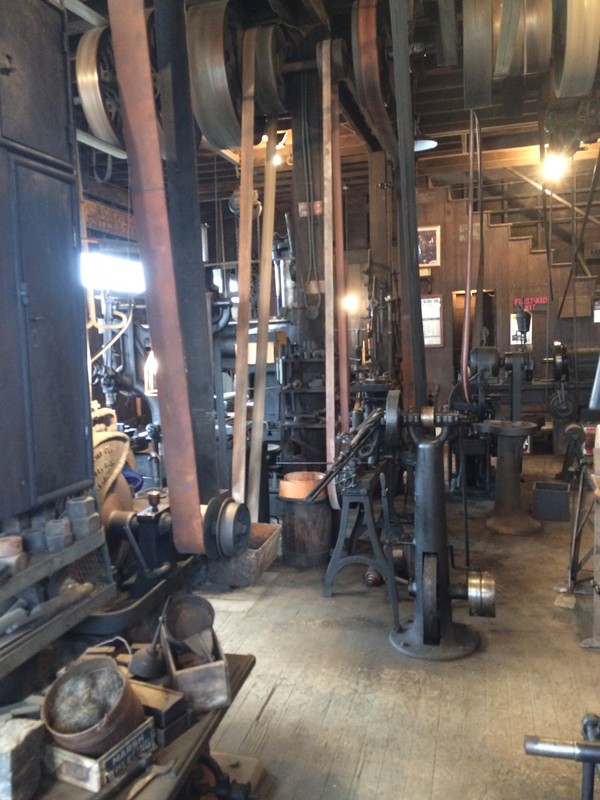 This photo shows the belt system used to run the various machines within the shop.