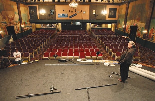 The savior of the Ritz, Bruce Curless, stands on the theatre's empty stage.  