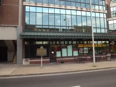 This is the street view of the African American Physicians marker. This marker can be seen easily from the road and stands in front of a glass building that is now a pizza restaurant. It is one marker in a series on the African American Trail.