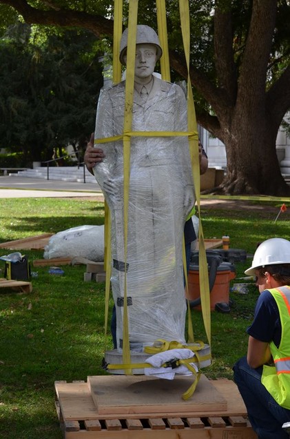 The weathered statue is temporarily removed in 2016 for the restoration process to begin (official Facebook page).