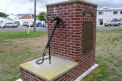 The monument for Leonard Lomell is replica of a grappling hook the men used to climb Pointe du Hoc on D-Day.