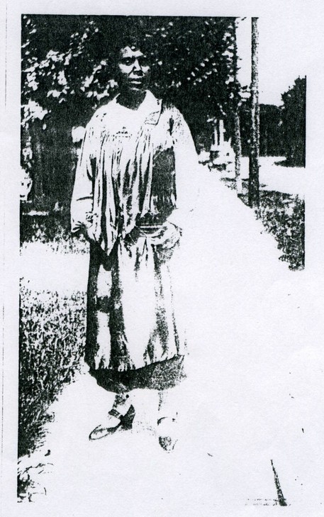 Nellie Craig standing on the sidewalk 