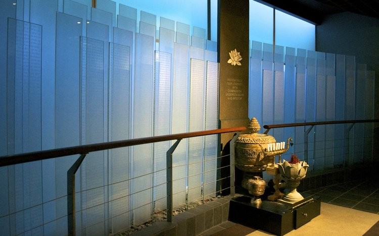 The Killing Fields Memorial honors the over two million victims of the Cambodian Genocide with their names engraved on a series of glass plates. Image obtained from the National Cambodian Heritage Museum & Killing Fields Memorial.