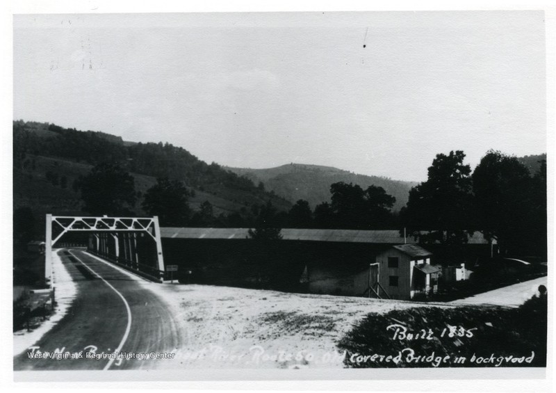 The same Cheat River Route 50 covered bridge in the background of a more modern iron bridge