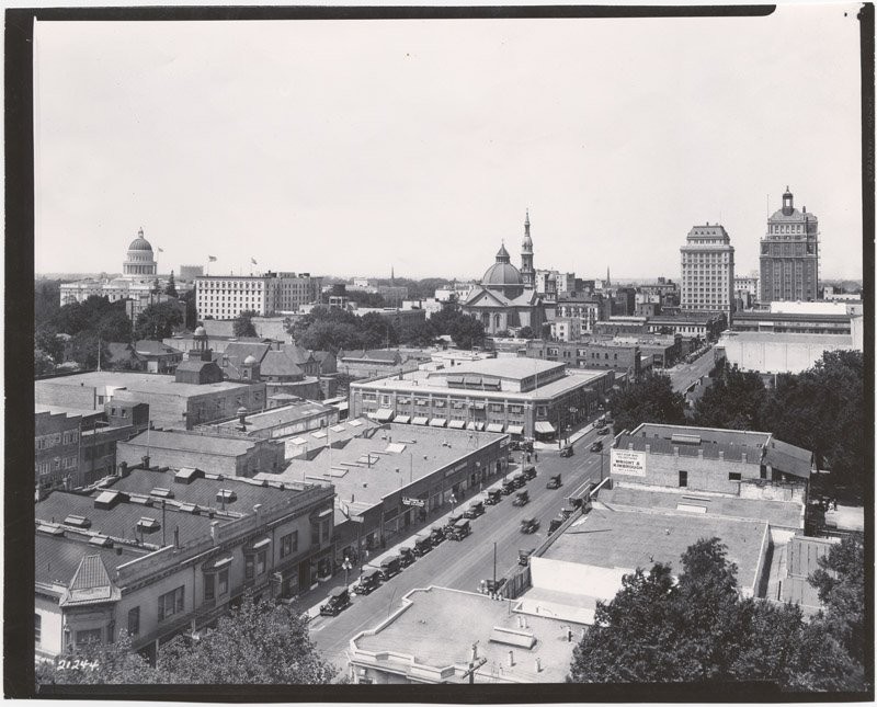 Completed earlier that year, the Elks Tower stands at far right, opposite the State Capitol (far left). The Cathedral of the Blessed Sacrament is at center (CA State Library).