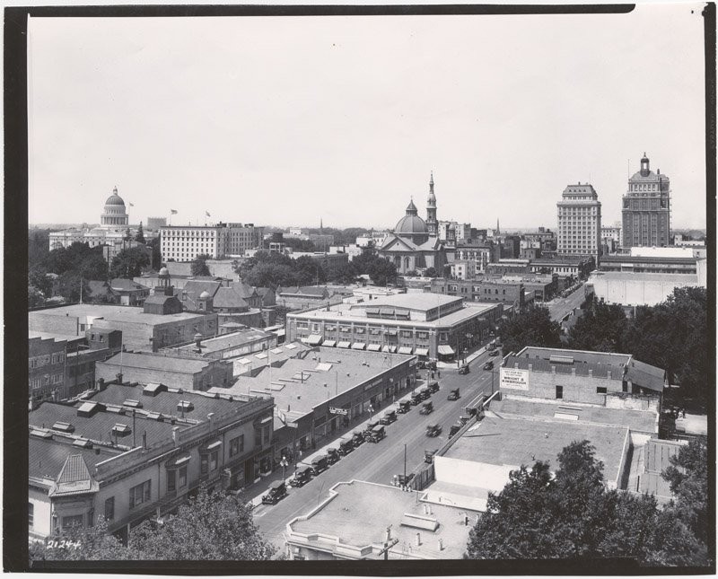 Completed earlier that year, the Elks Tower stands at far right, opposite the State Capitol (far left). The Cathedral of the Blessed Sacrament is at center (CA State Library).