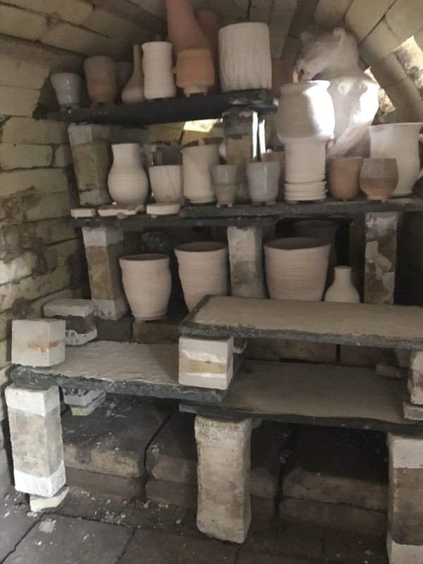 The inside of the kiln as it's being loaded with work