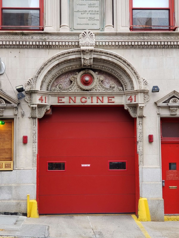 The red door distinguishes a Firehouse from civilian residences. (Photographed by the author, 2018)