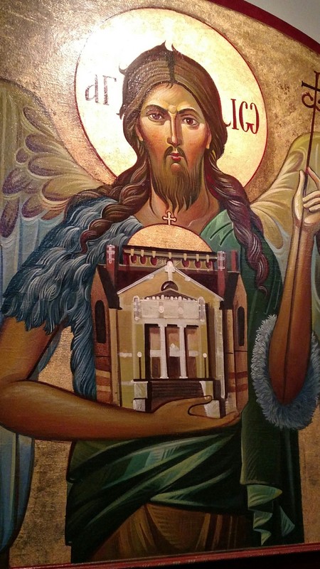 The eponymous St. John the Baptist, here shown holding a crosier (an Orthodox symbol of authority) in his left hand whilst he cradles the church in his right.