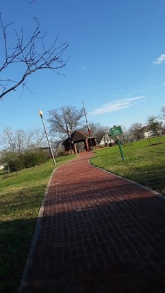 This is a picture of the park and the gazebo from the street entrance.