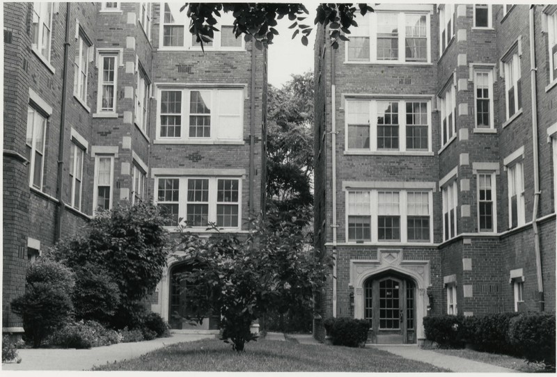 September 1983 - Close-up view of two apartment complexes with shared courtyard. 