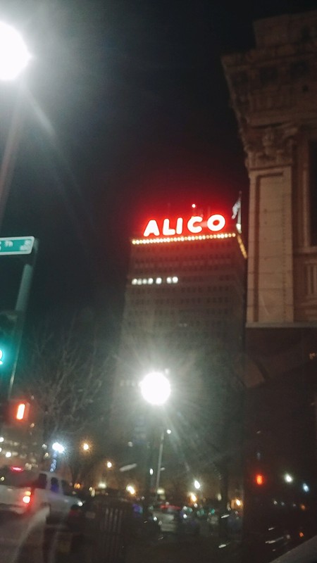 Front side of the ALICO Building with its glowing red letters