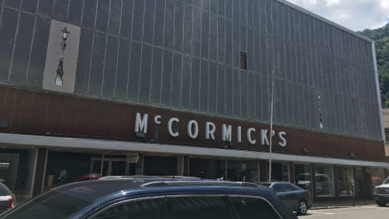 In the photo is McCormick's Furniture as it stands today. The business remains on the busy street corner beside of the Logan County Commission and the Logan Courthouse. 

Source: Google Maps