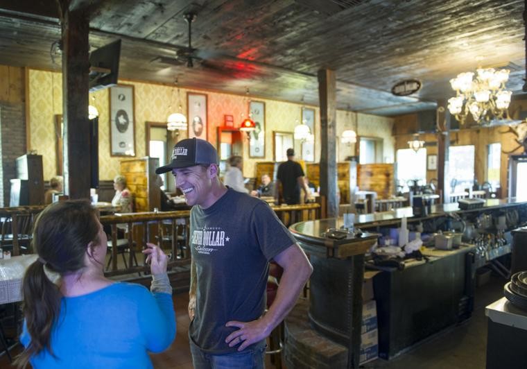 Owner Joe Ferrie speaks with a customer in April 2018. The building's history is an important part of the current business's identity (photo Chris Kaufman/Appeal-Democrat).