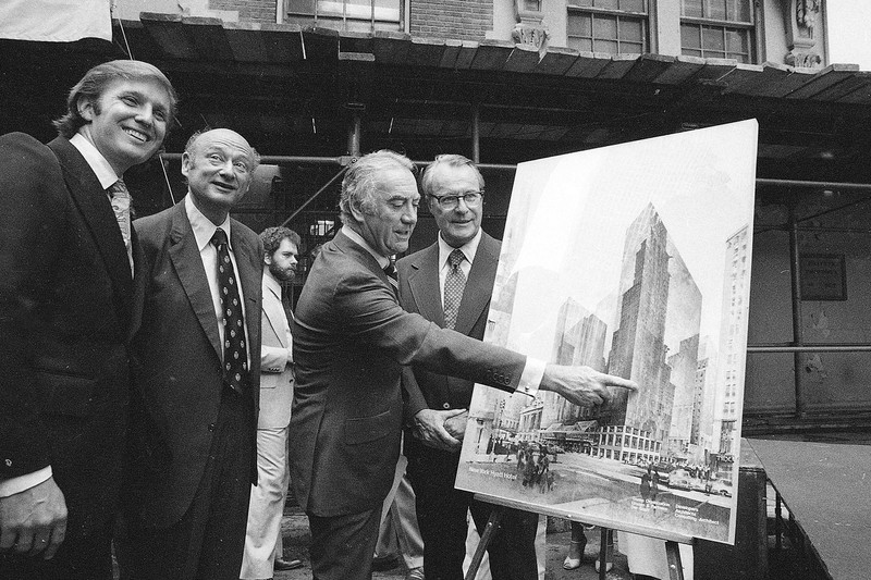 Donald Trump showing the plans for the new redo. 