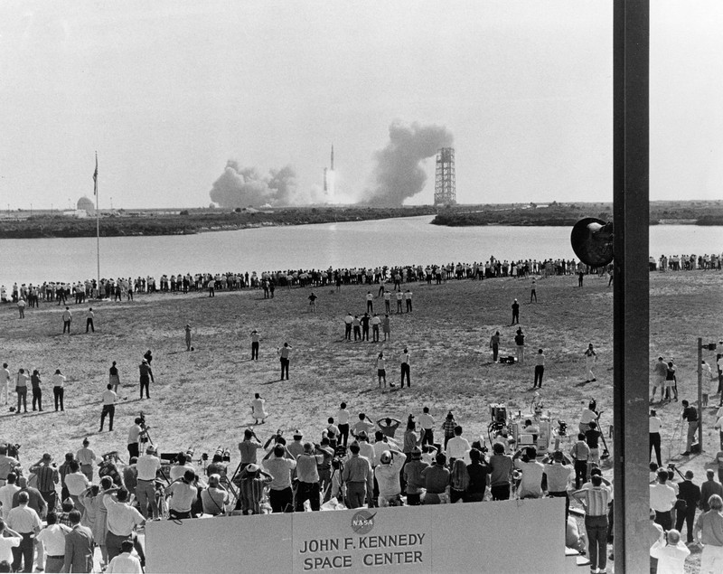 Thousands gathered at Kennedy Space Center on July 16, 1969, to watch the launch of Apollo 11. Four days later, on July 20, Neil Armstrong and Buzz Aldrin took the first steps on the Moon. Courtesy Project Apollo 11 Archive.