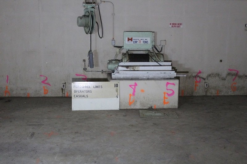 Winch in warhead building.  The orange paint was used to mark that people had tested this building for radiation and did not find any radiation.