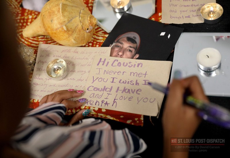 At the art exhibit, a cousin of Michael Brown Jr. writes a note to him. It depicts her wish of meeting him, and it is left with other artifacts that had meaning to Michael during his life.