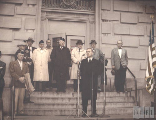 Man giving speech in front of Federal Building