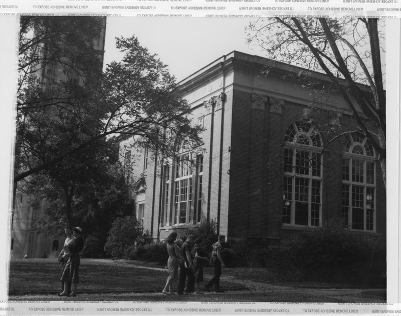 Wills Hall with student passing in front. 