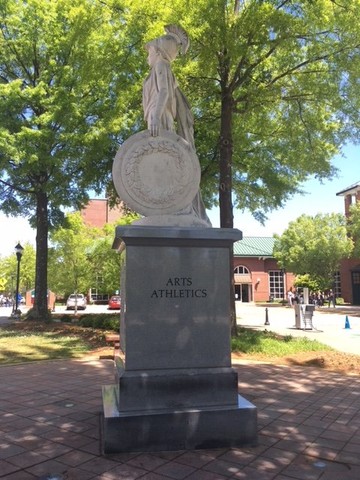 South side view of Athena and her shield; inscribed on the base are the words "Arts" and "Athletics"