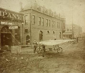 A 1907 photograph of Ben Epps with his first airplane outside of his garage