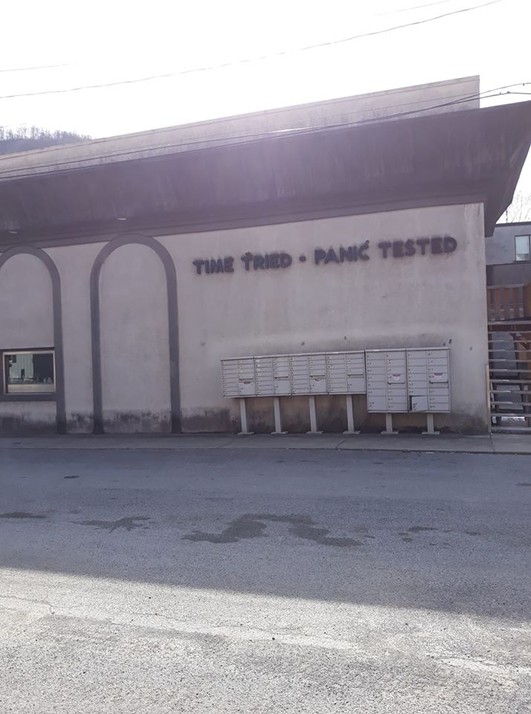 The Bank building (now the City Hall) in 2020 - note the bank's motto on the side of the building