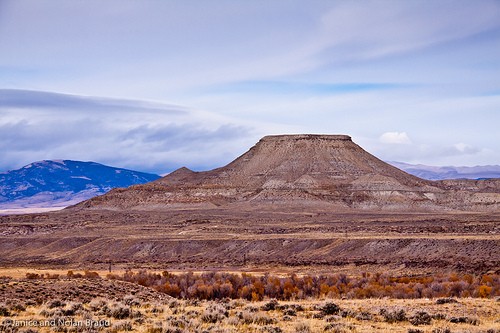 The rock formation is Crowheart Butte, where the Battle of Crowheart Butte took place.