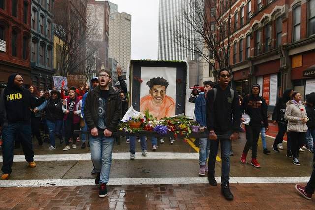 The Antwon Rose II memorial drawing is carried by protesters down Liberty Avenue in Pittsburgh days after Michael Rosfeld was acquitted of all charges