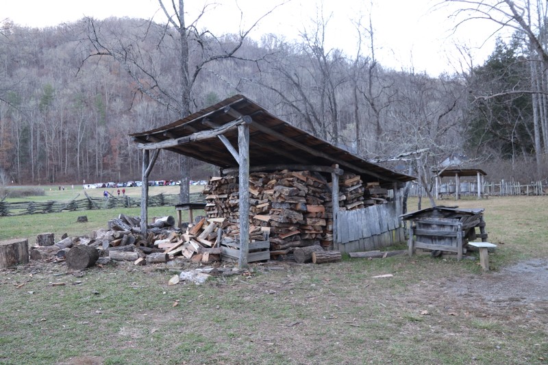 The ash hopper is the smaller box located to the right of the woodshed.
