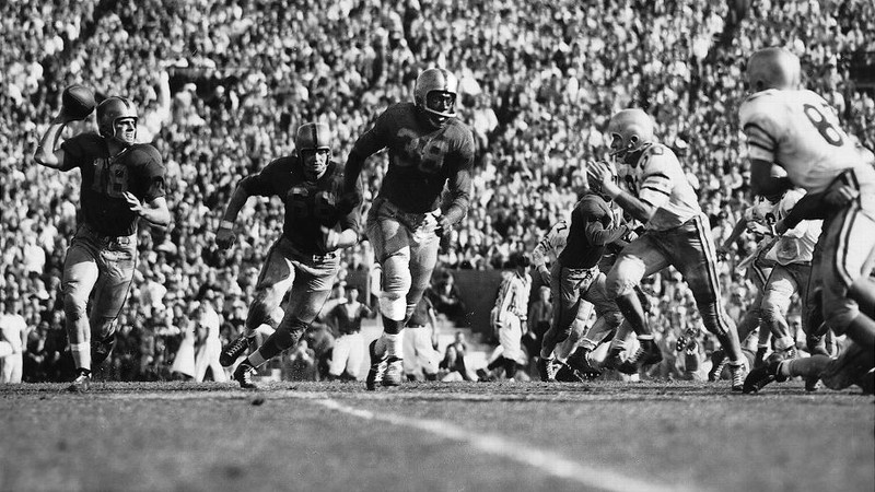 Bobby Grier (center) played in the 1956 Sugar Bowl as a fullback for the Pittsburgh Panthers. Though his team lost 7-0, his presence in the game signified the first time major college football in the South was integrated. 