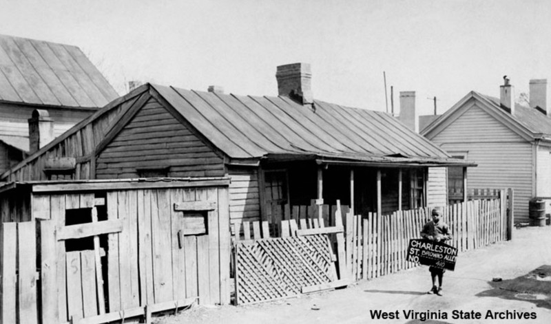 410 Brown’s Alley in the 1930s. Cramer Bollinger probably took the photo in 1936 when he was compiling pictures for a presentation on urban blight. The identity of the boy in the image is unknown. 