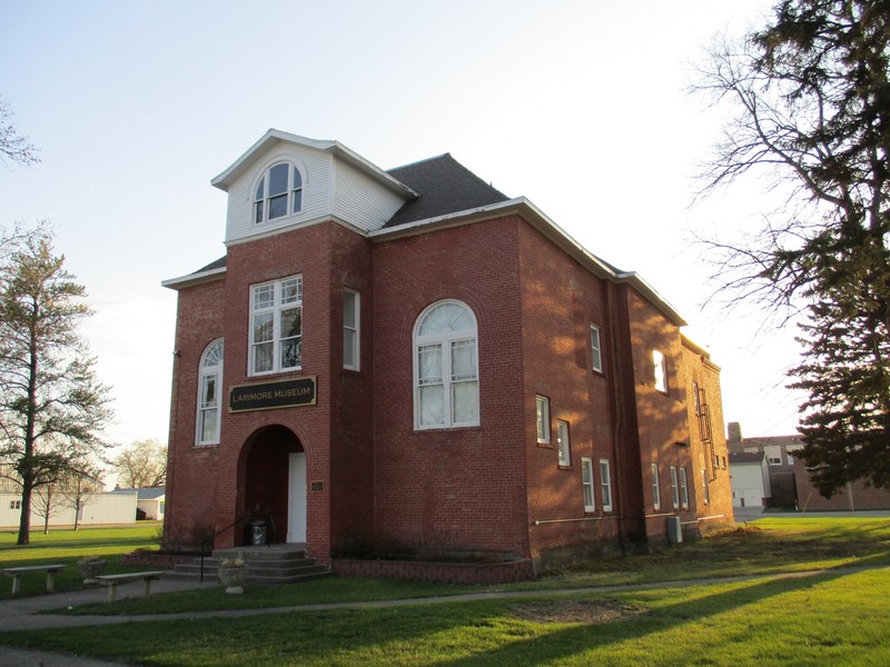 Old Larimore City Hall in the evening. This image shows the east (front) and north sides of the building. Evidence of the removed large Colonial Style fanlight window can be seen on the second floor of the north side.