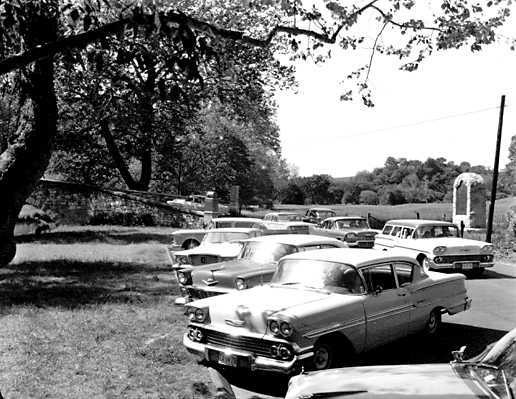 In the postwar era, more Americans than ever before were driving inexpensive cars on new highways and discovering the country's National Parks. This image shows traffic backing up at Burnside Bridge. National Park Service photo.