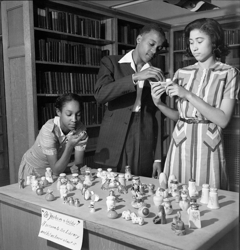 Vashon High School Students at a hobby show looking at collectible salt and pepper shakers, 1941.