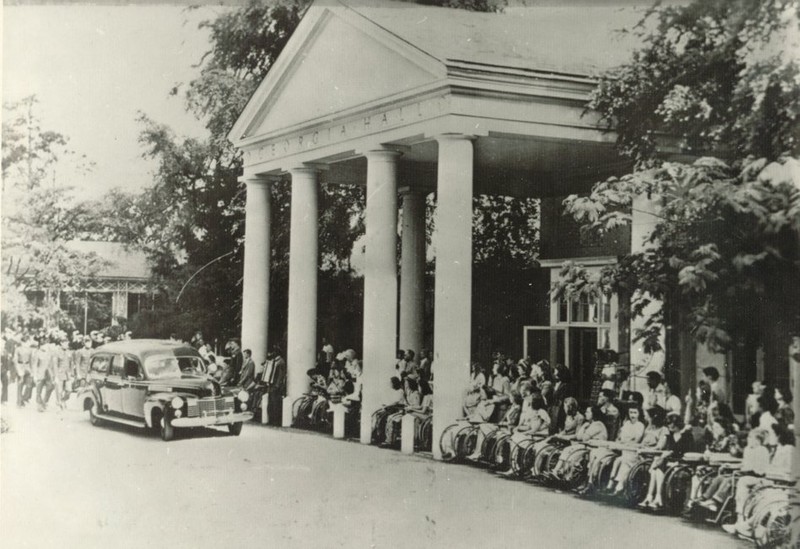 Polio patients line-up at the Georgia Hall to watch the hearse carrying the coffin of President Roosevelt leave the Georgia Warm Springs Foundation. April 13, 1945. 