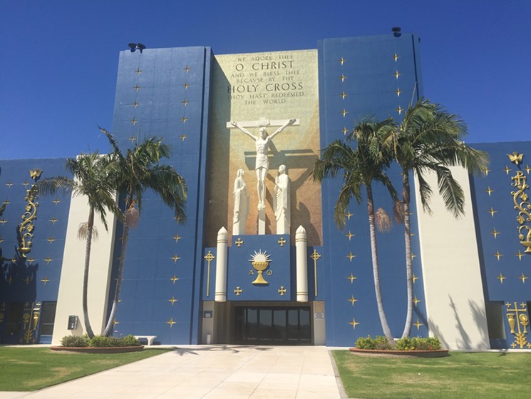 The main administrative building at Holy Cross, in front of the mausoleum, with offices and chapels