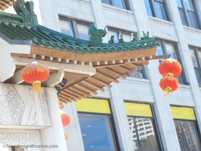 A view of some of the gate's details and the hanging lanterns.