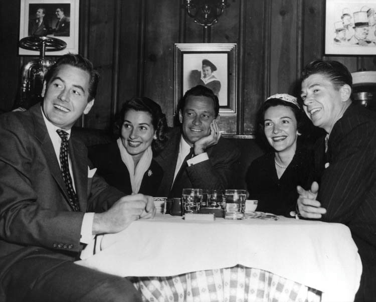 Don De Fore, Brenda Marshall (Mrs. William Holden), William Holden, and Nancy and Ronald Reagan at Chasen's Restaurant. Ronald Reagan proposed to Nancy Davis in Booth 2 at Chasen's in 1952. 