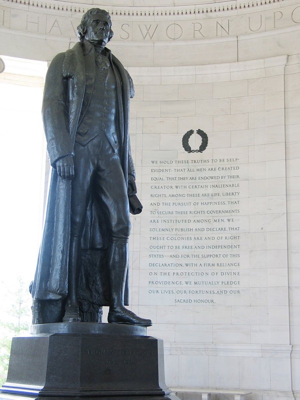 The 19-foot bronze statue of Thomas Jefferson stands by an engraving of the Declaration of Independence. Wikimedia Commons. 