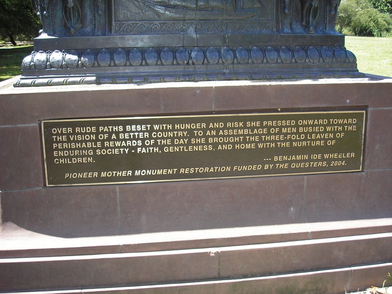 2004 plaque at base of statue