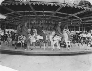 The Carousel at Lakewood Park in the 1930s. The executives of the Philadelphia Toboggan Company that created the hand painted horses in 1925 are to sitting atop the horses. Each horse is unique.